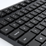 Xiaomi Wireless Keyboard Mouse Combo (WXJS01YM) in black on a tidy office desk.