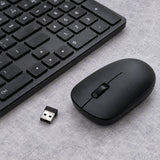 Xiaomi Wireless Keyboard Mouse Combo (WXJS01YM) in black on a tidy office desk.