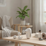 White and silver Professional Ultra-Portable Deep Tissue Mini Massager with four interchangeable massage heads._corporate gifts singapore_personalised corporate gifts